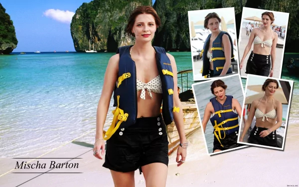 HD PC desktop wallpaper featuring celebrity Mischa Barton in a beach setting, wearing a life vest over a bikini top with scenic cliffs and ocean in the background.