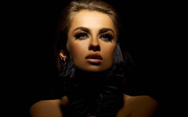 HD PC desktop wallpaper featuring a dramatic portrait of woman Natalia Siwiec illuminated against a dark background.