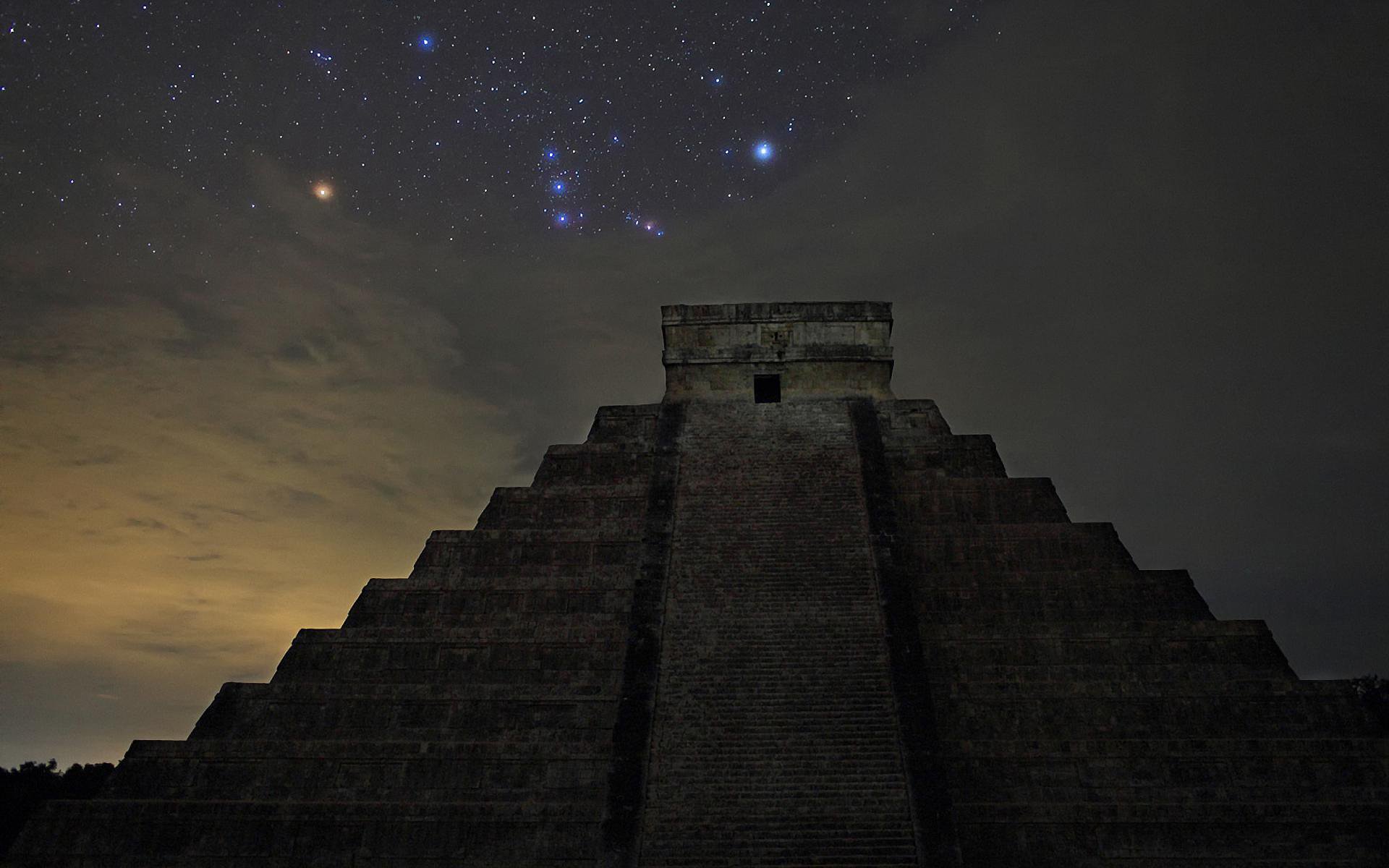 HD PC desktop wallpaper featuring the man-made Chichen Itza pyramid silhouetted against a starry night sky.