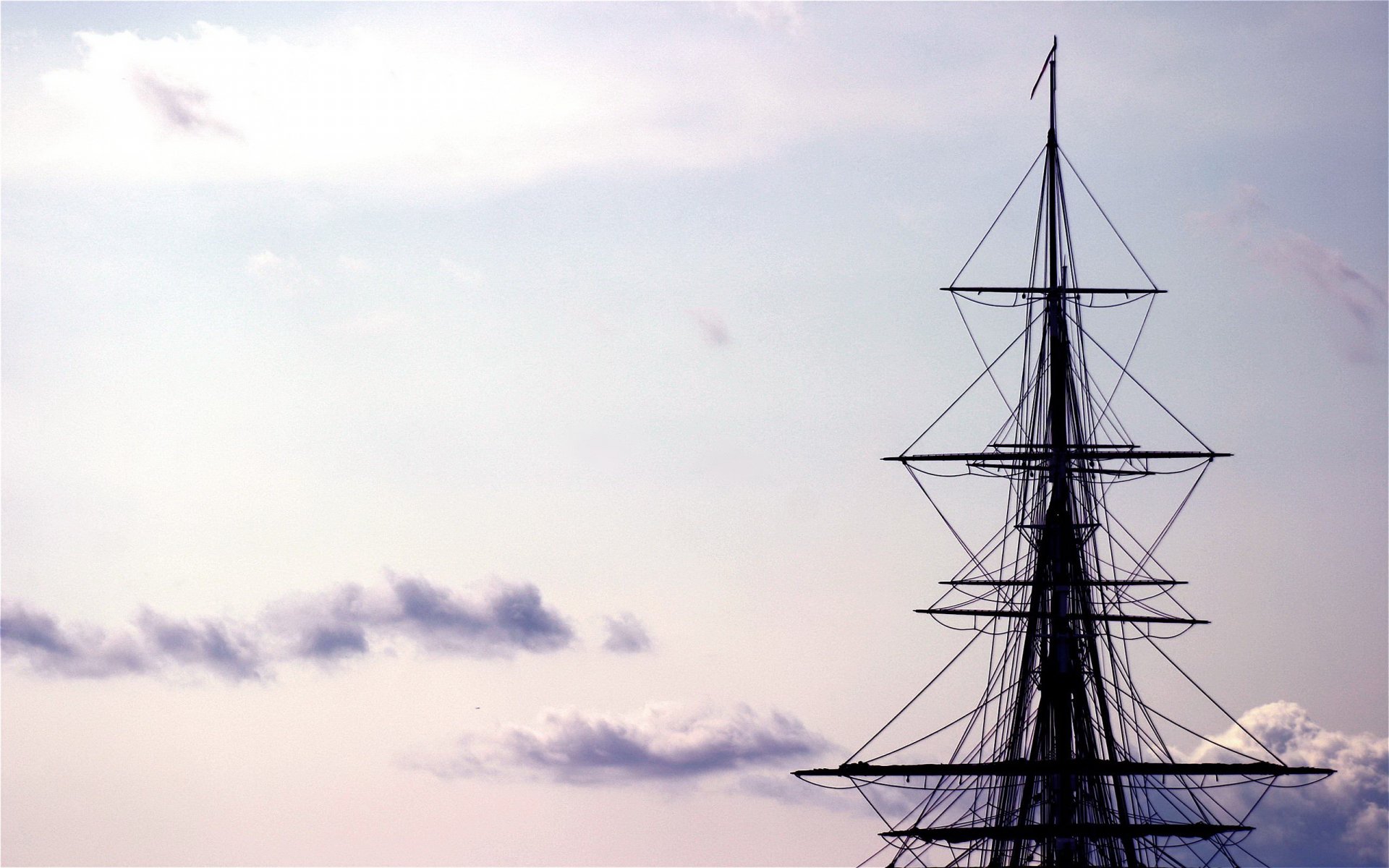 HD desktop wallpaper of a sailboat's mast and rigging silhouetted against a serene sky with soft clouds.