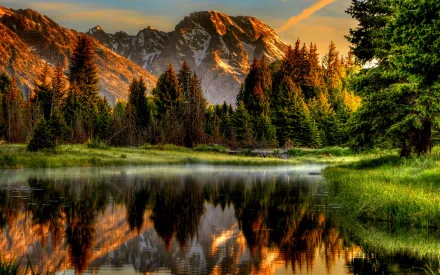 HD desktop wallpaper of a serene river flowing through a lush green forest with majestic mountains in the background, all beautifully reflected in the water, captured in HDR.
