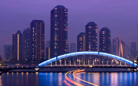 Chuo-Ohashi and Eitai Bridges at twilight in Tokyo, Japan — illuminated arch and river light trails; 2K Quad HD desktop wallpaper of a man-made cityscape.