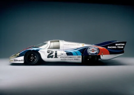 Side profile of a Porsche race car No. 21 in Martini livery, presented as a 2K Quad HD PC desktop wallpaper and background.