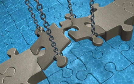 CGI 3D image of large man-made puzzle pieces suspended by chains over a blue puzzle background, designed as a HD PC desktop wallpaper and background.