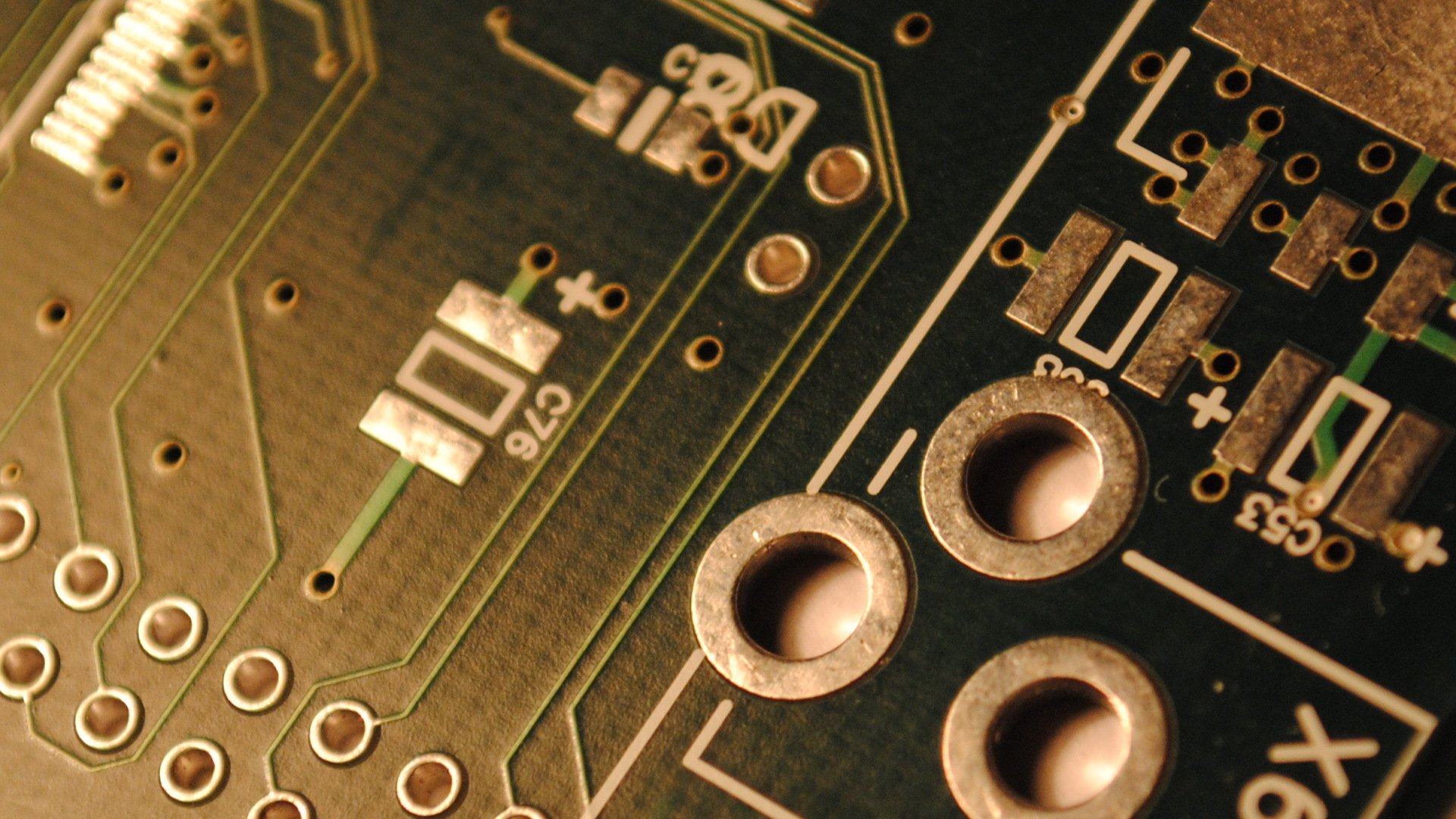 Close-up HD desktop wallpaper showcasing intricate technology circuit patterns with metallic components and detailed connections.