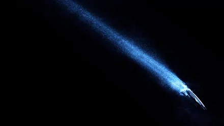 A stunning HD wallpaper of the Normandy SR-1 spaceship from the video game Mass Effect, featuring a striking blue light beam against a dark background.