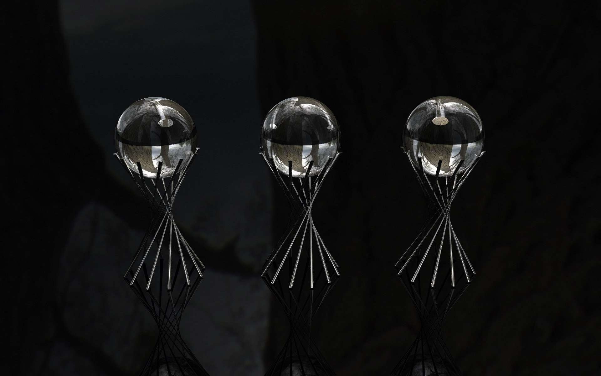 Abstract HD PC desktop wallpaper featuring three transparent spheres balanced on slender, angled stands against a dark, reflective background.
