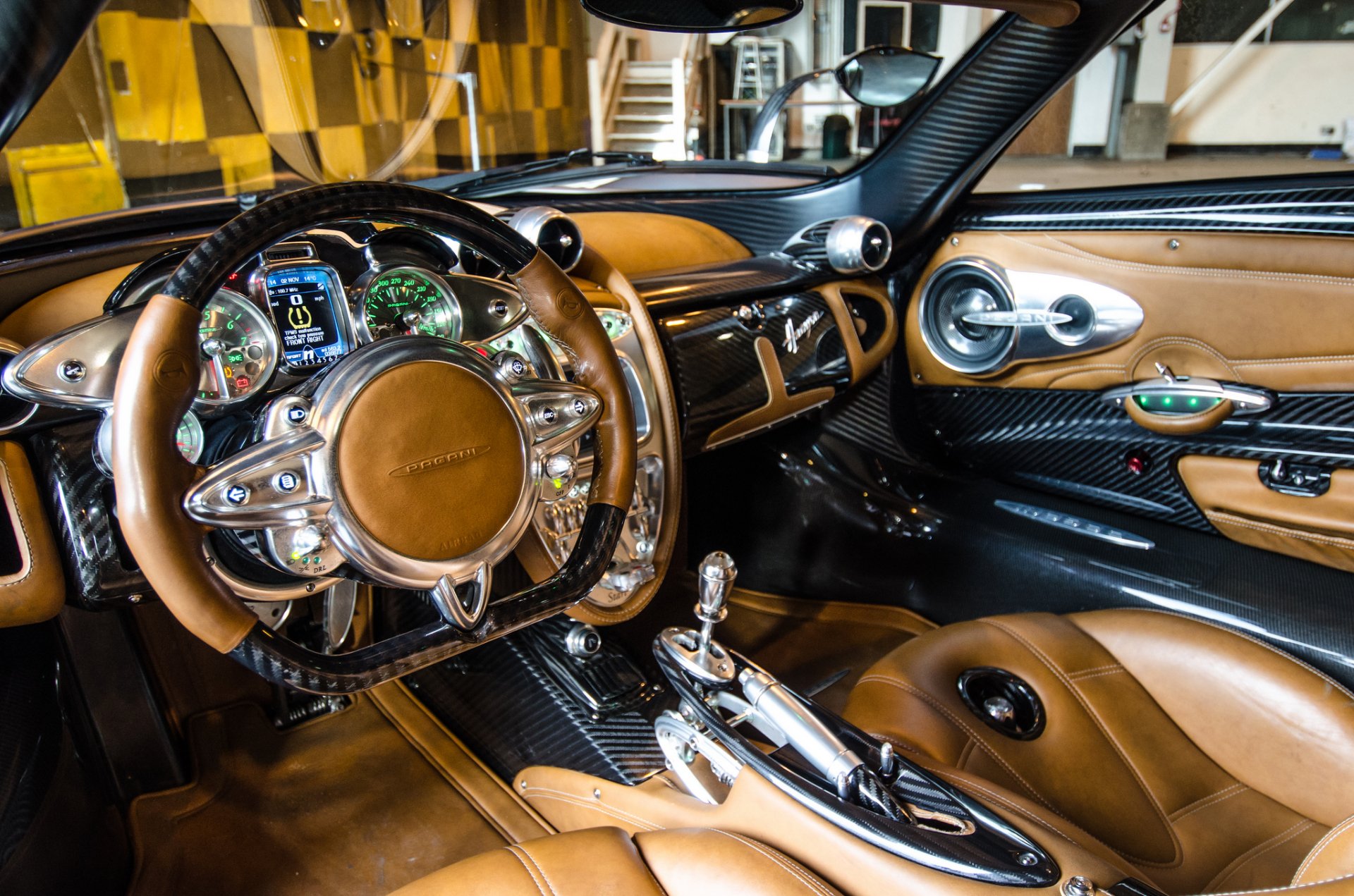 HD PC desktop wallpaper showcasing the luxurious interior and detailed dashboard of a Pagani Huayra vehicle.