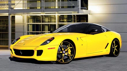 HD PC desktop wallpaper featuring a sleek yellow Ferrari sports car parked in front of a modern building, showcasing its dynamic design and vibrant color.
