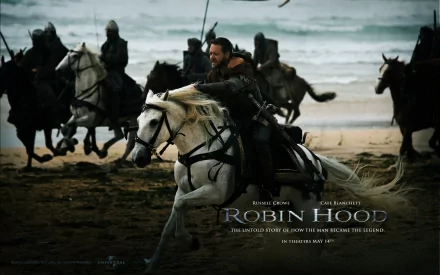 HD PC wallpaper featuring Russell Crowe as Robin Hood riding a white horse on a beach, with armored riders in pursuit, from the 2010 movie Robin Hood.