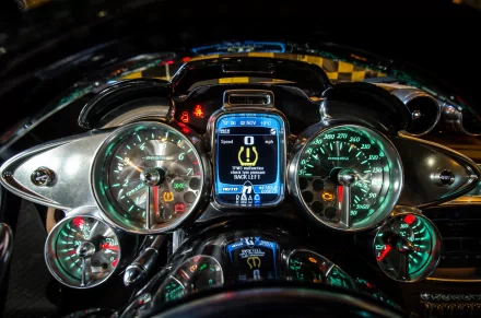 Detailed view of the dashboard of a Pagani Huayra, showcasing its sleek design and high-tech instrumentation. This HD image serves as a striking desktop wallpaper.