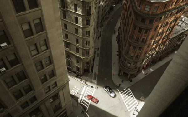 A Jaguar E-Type driving through narrow city streets, captured from above in an HD PC desktop wallpaper and background.