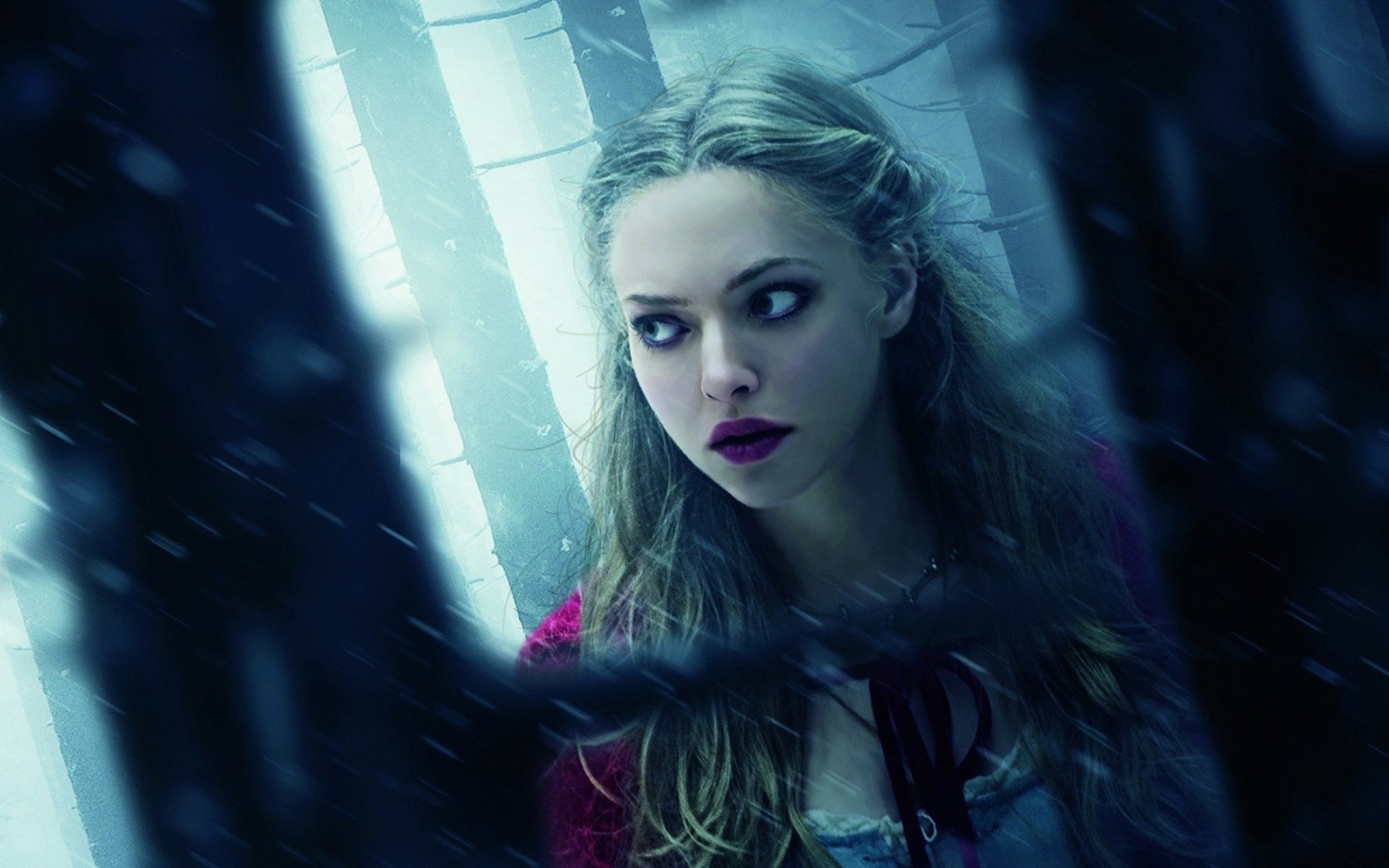 HD desktop wallpaper featuring celebrity Amanda Seyfried with a moody, cinematic blue-toned background.