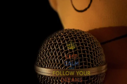 Close-up of a microphone with a motivational message inspired by The Simpsons, blending music and encouragement in a 4K Ultra HD TV show desktop wallpaper.