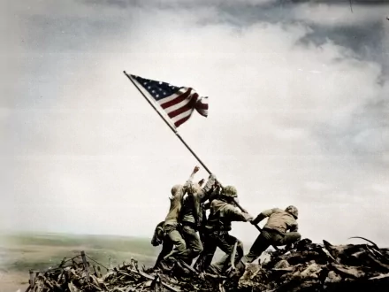 Five marines raise the American flag during the Battle of Iwo Jima in World War II. This HD desktop wallpaper captures a historic moment with soldiers united in triumph.