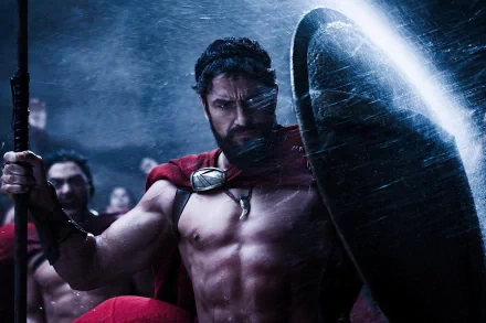 Epic HD wallpaper featuring King Leonidas, portrayed by Gerard Butler, from the movie 300, showcasing intense battle scenes and a heroic stance.