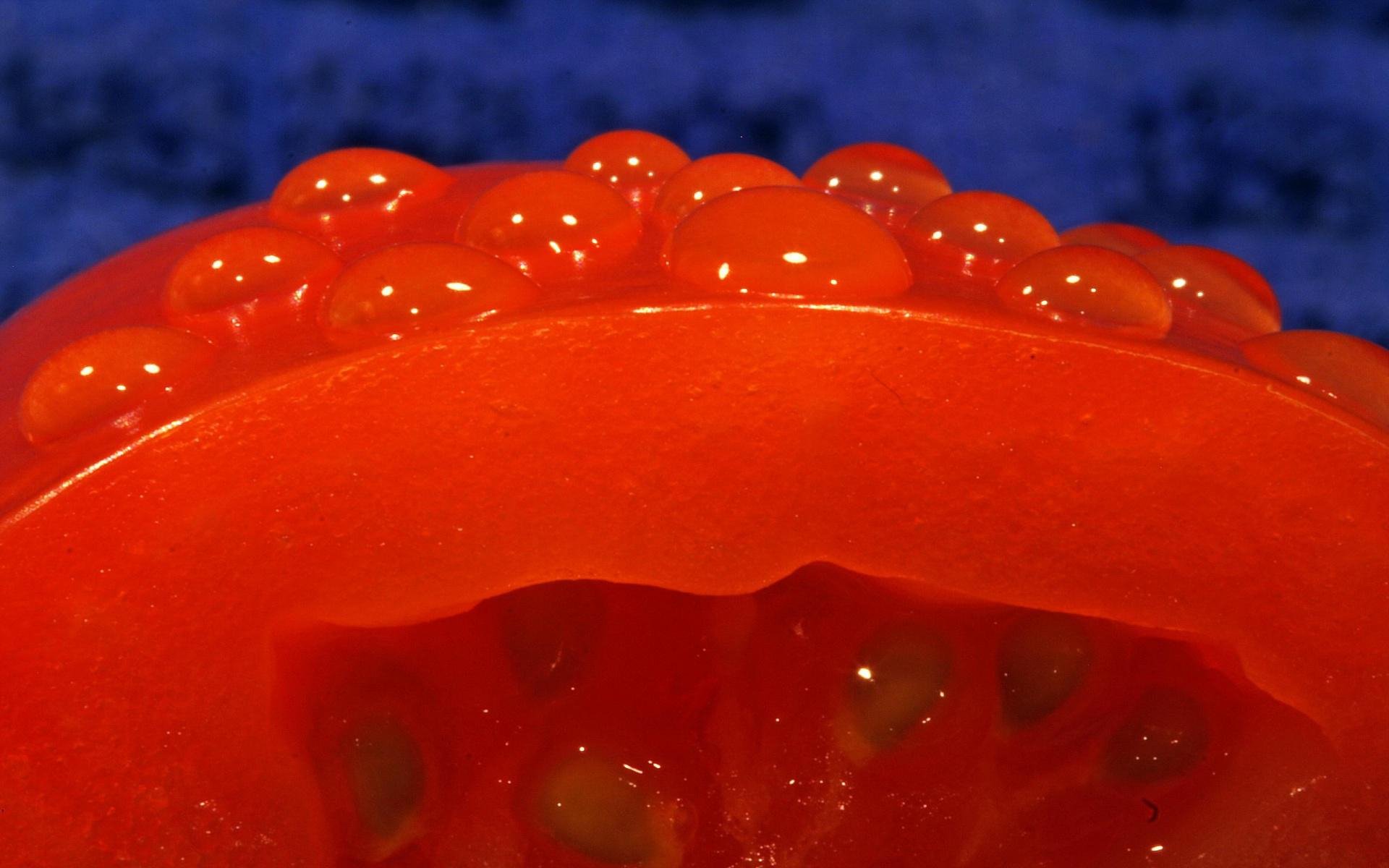 HD PC desktop wallpaper/background: extreme close-up of a sliced tomato showing glossy red flesh and seeds — vivid food, tomato image.