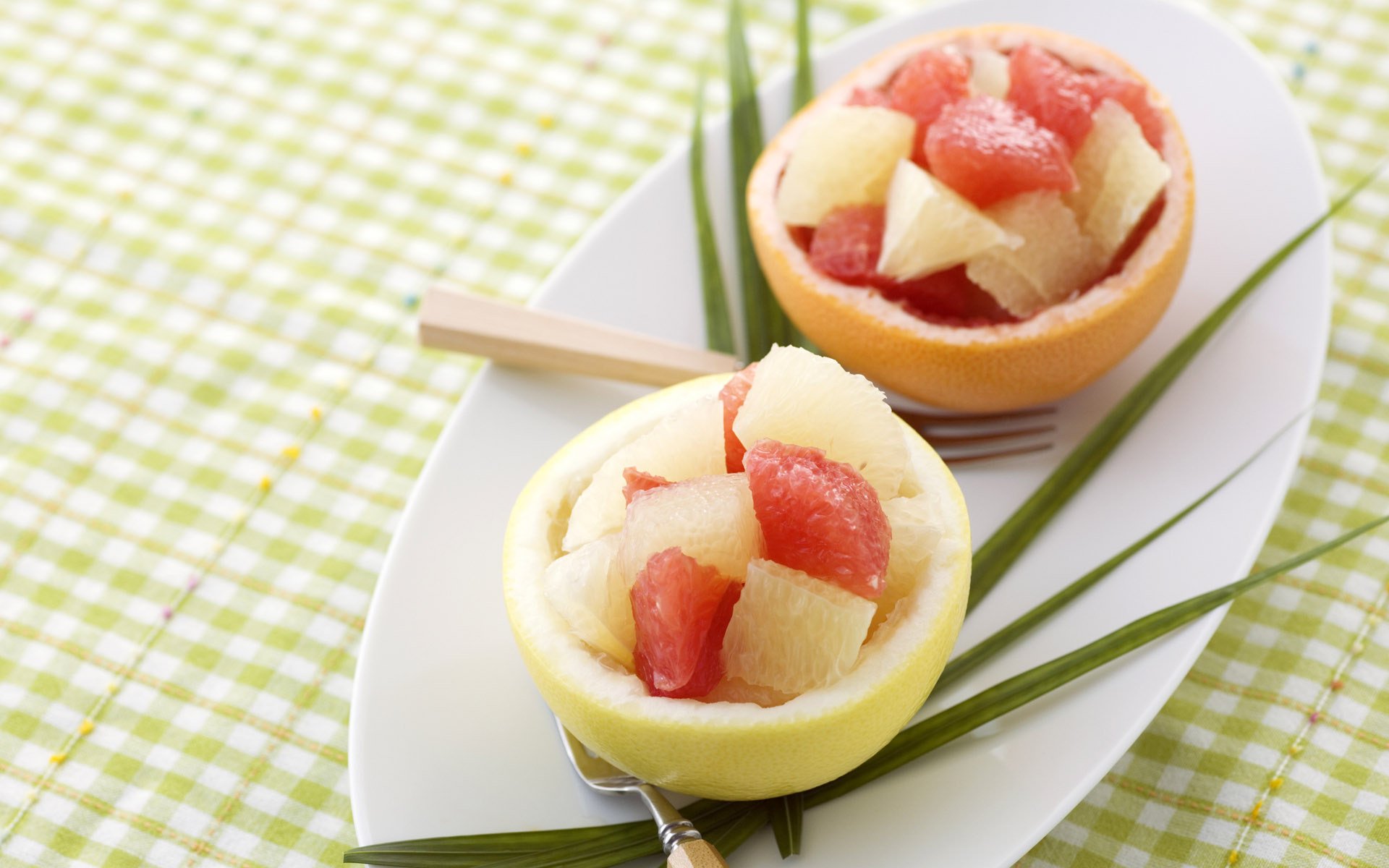 HD PC desktop wallpaper and background: food dessert — hollowed citrus bowls filled with diced melon and grapefruit on a white platter over green gingham cloth.