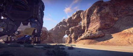 HD desktop wallpaper depicting a rocky canyon scene from the game Planetside 2 with a mech stationed to the left.