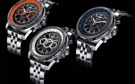 HD PC desktop wallpaper featuring three man-made luxury wristwatches with detailed dials and metal bands against a black background.