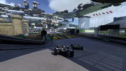 HD PC desktop wallpaper of TrackMania 2 Stadium: two Cars-style race cars racing on a winding stadium track with elevated loops, grandstands and flags.