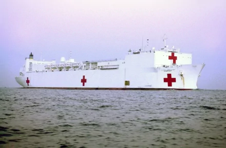 HD desktop wallpaper: USNS Comfort (T-AH-20), U.S. Navy military hospital ship/warship with large red crosses on its white hull sailing at sea.