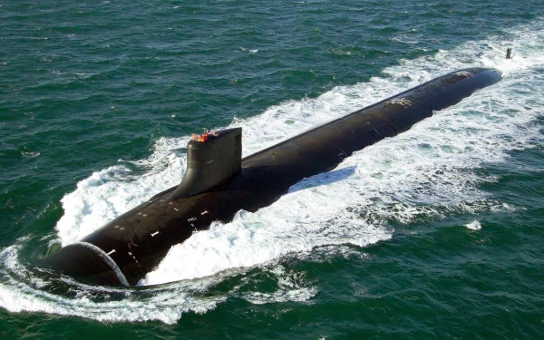 HD desktop wallpaper showing the USS Jimmy Carter (SSN-23) military submarine cutting through ocean waters as a powerful warship.