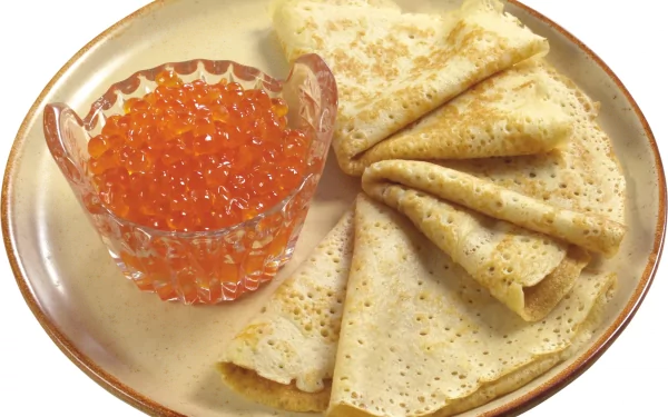 2K Quad HD PC desktop wallpaper/background: plate of folded crêpes beside a crystal bowl of bright orange salmon caviar.