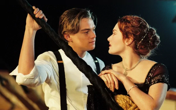HD desktop wallpaper featuring Leonardo DiCaprio and Kate Winslet in a scene from the movie Titanic, showcasing an iconic moment from the film.