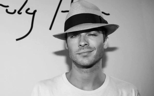 Black and white photo of celebrity Ian Somerhalder. He is smiling and wearing a hat, making it a stylish HD desktop wallpaper and background.
