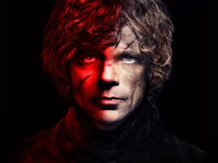 HD desktop wallpaper of Peter Dinklage as Tyrion Lannister from the TV show Game of Thrones, featuring a moody and intense close-up of his face with contrasting shadows and highlights.