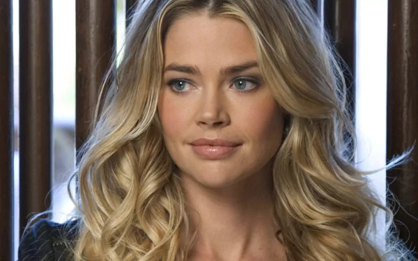 HD PC desktop wallpaper featuring a close-up of celebrity Denise Richards with soft blonde curls and a calm expression.