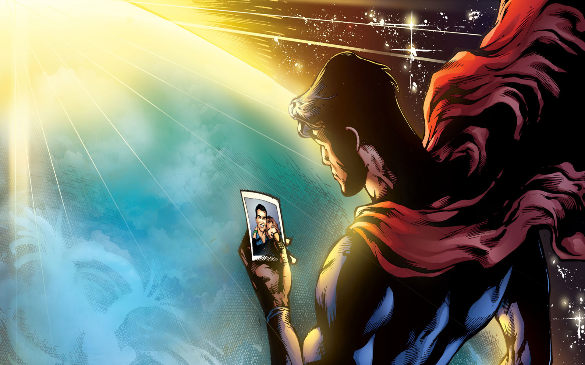 HD comic-style Superman desktop wallpaper showing the hero gazing at a glowing light while holding a photo, with his red cape flowing behind him.