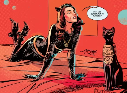 HD PC desktop wallpaper featuring a comic-style Catwoman in a sleek black outfit, posing confidently beside a stylized black cat statue on a vibrant red background.