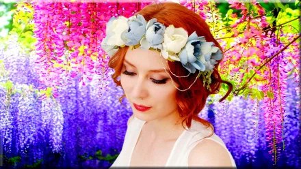 HD PC desktop wallpaper featuring a redhead woman model wearing a floral crown, set against a vibrant backdrop of pink and purple cascading blossoms.