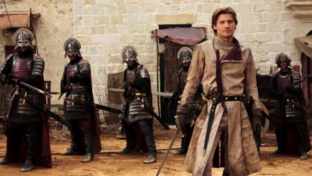 Jaime Lannister, portrayed by Nikolaj Coster-Waldau, stands confidently in front of armored soldiers in this HD Game of Thrones wallpaper, capturing a key moment from the TV show.