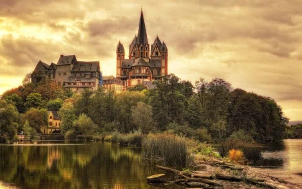 Limburg Cathedral stands majestically above the river, showcasing stunning architecture and a rich history in Germany. This HD desktop wallpaper captures its enchanting landscape.