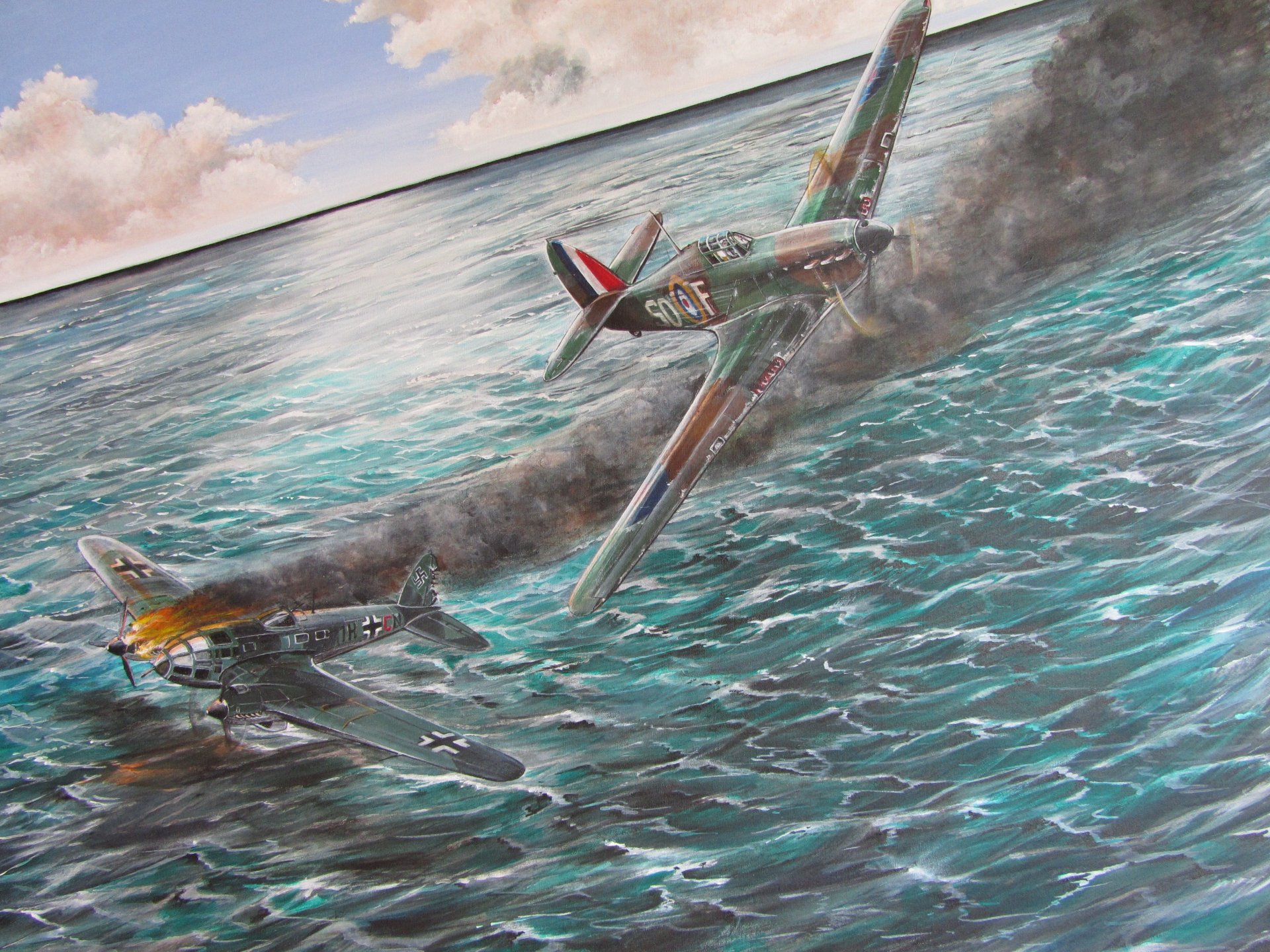 4K Ultra HD desktop wallpaper depicting two military aircraft engaged in a low-altitude aerial battle over the ocean, with one trailing smoke.