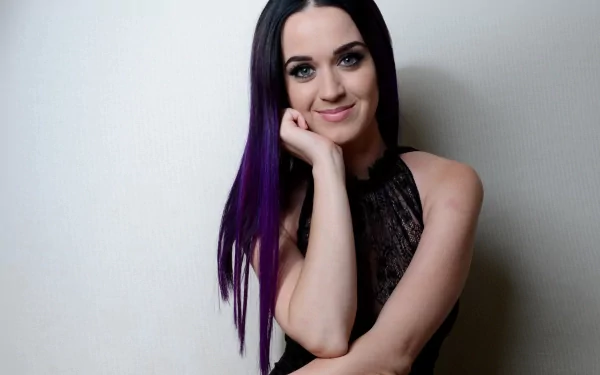 A HD desktop wallpaper featuring a smiling singer with blue eyes and long purple hair.