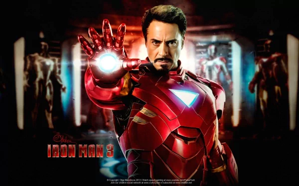 A dynamic HD wallpaper featuring Iron Man from Iron Man 3, showcasing the character in his iconic red armor, poised with a glowing repulsor in a striking pose.