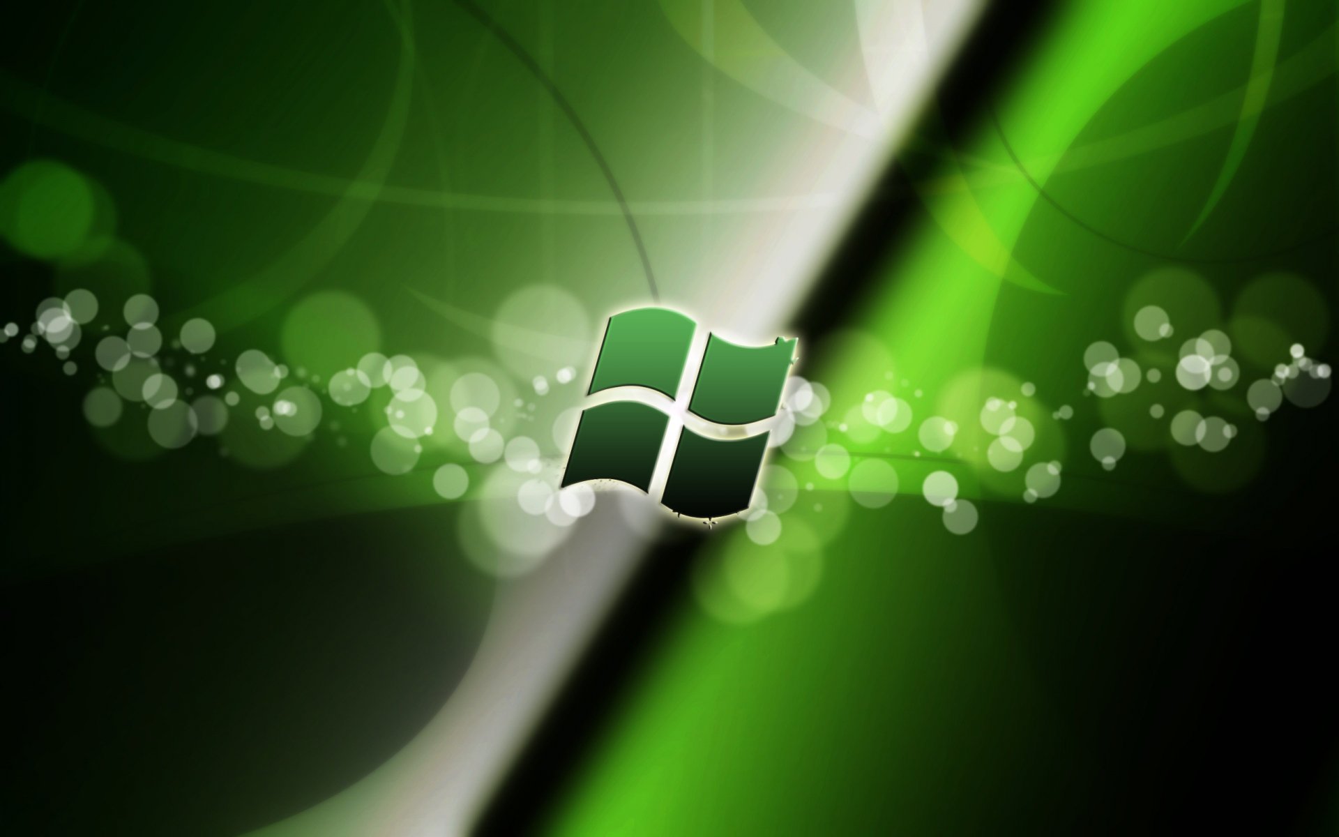 HD PC desktop wallpaper featuring a glowing Windows logo with dynamic green and black tech-inspired abstract background.