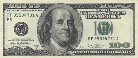 Close-up of a man-made U.S. one hundred dollar bill featuring Benjamin Franklin, rendered in 4K Ultra HD as a PC desktop wallpaper and background.