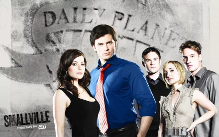 HD wallpaper featuring Erica Durance and the main cast of the TV show Smallville, with a backdrop of the Daily Planet logo, showcasing their iconic characters.