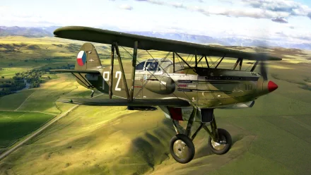 Military Avia B-534 biplane flying over a green landscape under a cloudy sky, presented as a HD PC desktop wallpaper and background.