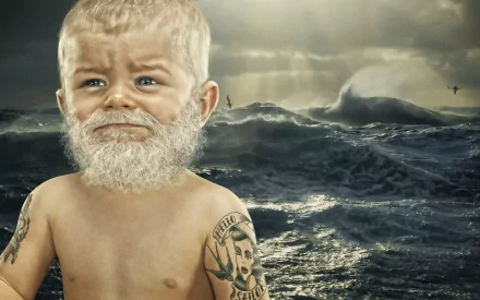 A captivating HD wallpaper featuring a baby with a beard and tattoos standing against a dramatic ocean backdrop, blending photography with whimsical artistry.