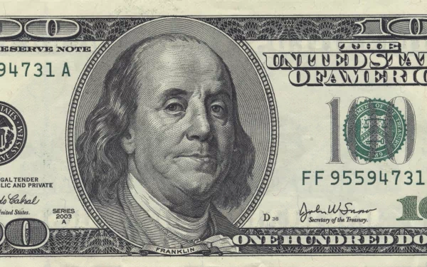 Close-up of a man-made U.S. one hundred dollar bill featuring Benjamin Franklin, rendered in 4K Ultra HD as a PC desktop wallpaper and background.
