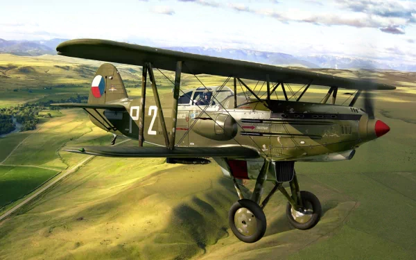 Military Avia B-534 biplane flying over a green landscape under a cloudy sky, presented as a HD PC desktop wallpaper and background.