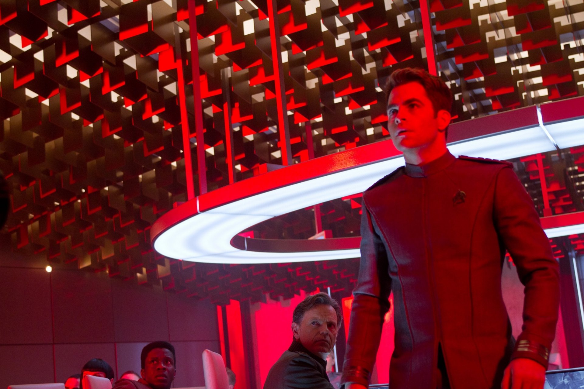 HD PC desktop wallpaper featuring a scene from the movie Star Trek Into Darkness with characters set against a futuristic, red-lit background.