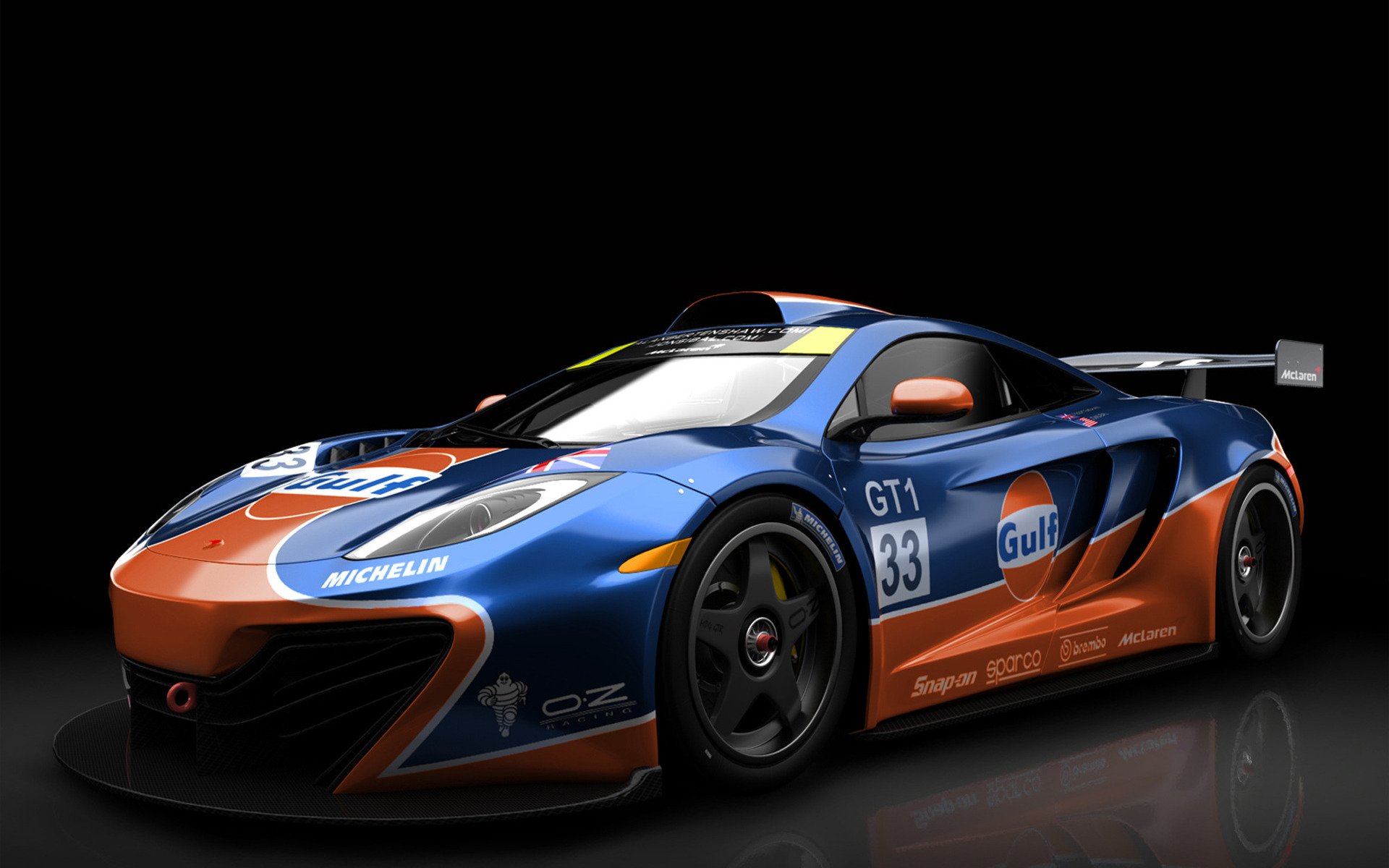 HD PC desktop wallpaper featuring a McLaren GT3 race car in blue and orange Gulf livery against a black background.
