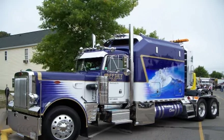 A polished Peterbilt truck with a custom ocean wave mural, captured in high definition, making a striking HD PC desktop wallpaper and background.